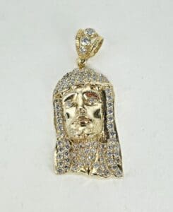 Gold pendant with diamond embellishments.