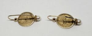 Gold coin earrings with pearls and rubies.