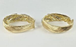 Gold hoop earrings with diamond accents.