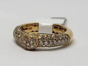 Gold ring with heart-shaped diamond cluster.