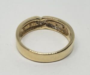 Gold ring with engraved interior design.