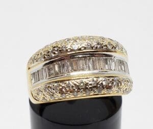 Gold and silver textured ring with diamonds.