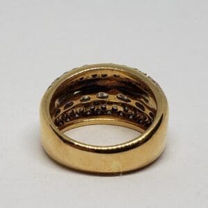 Gold ring with embedded gemstones.