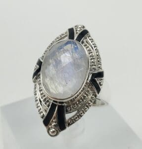 Silver ring with large oval gemstone.