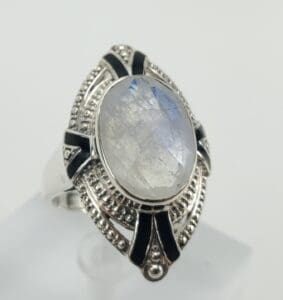 Moonstone ring with intricate silver design.