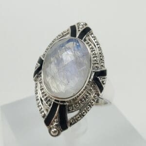 Silver ring with large oval gemstone.