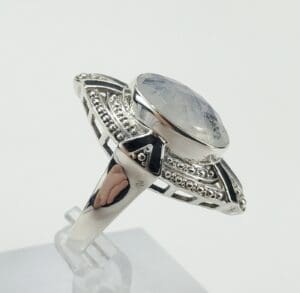 Silver ring with large oval gemstone.
