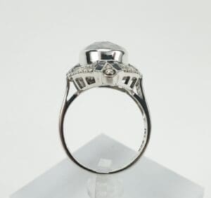 Side view of ornate silver ring setting.