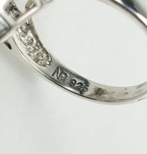 Silver ring with "925" hallmark engraving.