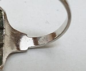 Close-up of a silver ring band.