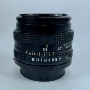 Camera lens with aperture and focus markings.