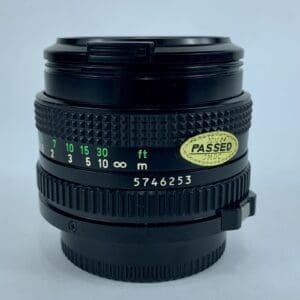 Camera lens with distance markings and sticker.