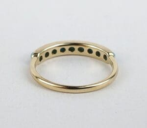 Gold ring with small holes underneath.
