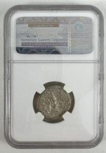 Silver coin in graded display case.