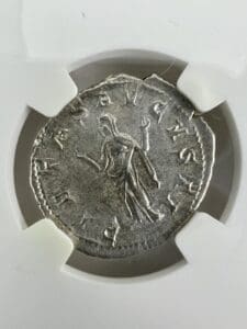 Ancient silver coin with engraved figure.