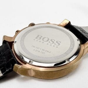 Hugo Boss watch with leather strap back.