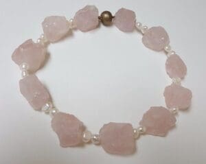 Pink stone and pearl beaded necklace.