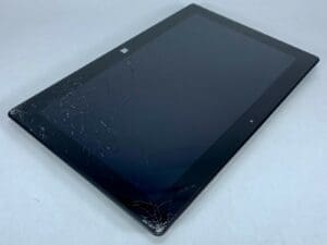 Cracked screen on black tablet device.