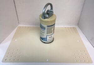 Cylinder attached to perforated flat panel.