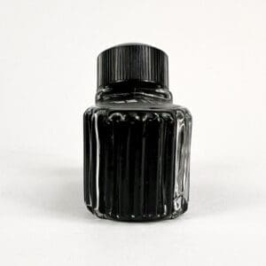 Black ink bottle with ridged design.
