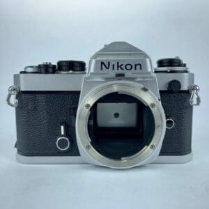 Vintage Nikon film camera without a lens.