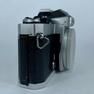 Vintage silver and black camera side view.