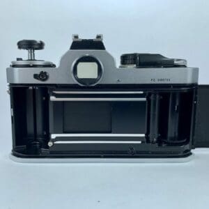 Open vintage camera back without film.