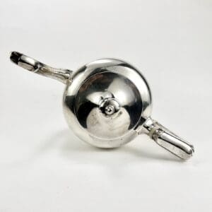 Silver teapot viewed from above.