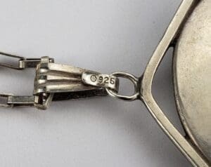 Silver jewelry with a "925" hallmark stamp.