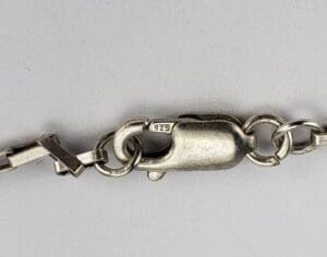 Silver bracelet clasp with "925" stamp.