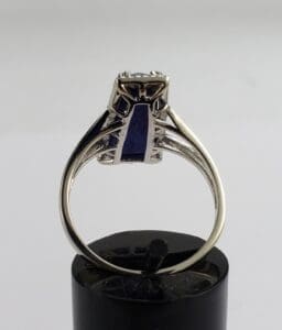 Silver ring with a blue gemstone.