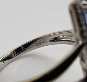 Close-up of engraved silver ring interior.