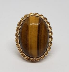 Gold ring with oval tiger's eye stone.
