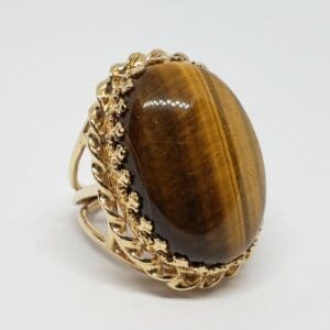 Gold ring with tiger's eye gemstone.