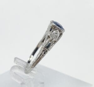 Silver ring with blue and clear gemstones.