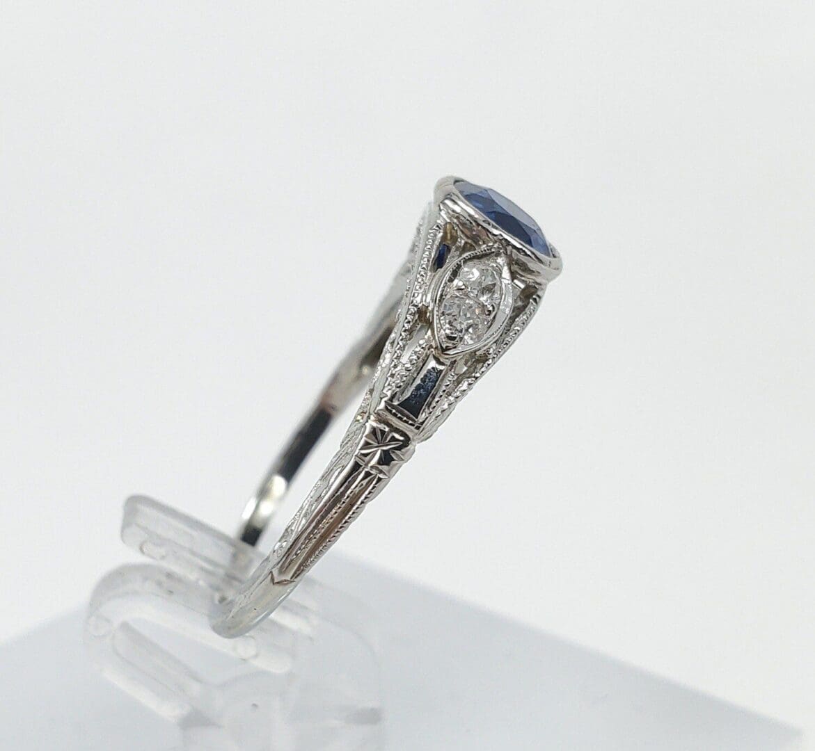 Silver ring with blue and clear gemstones.