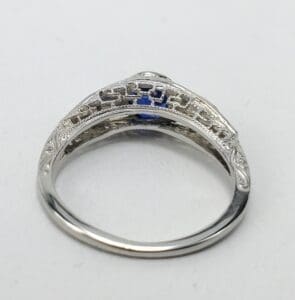 Ornate silver ring with intricate detailing.