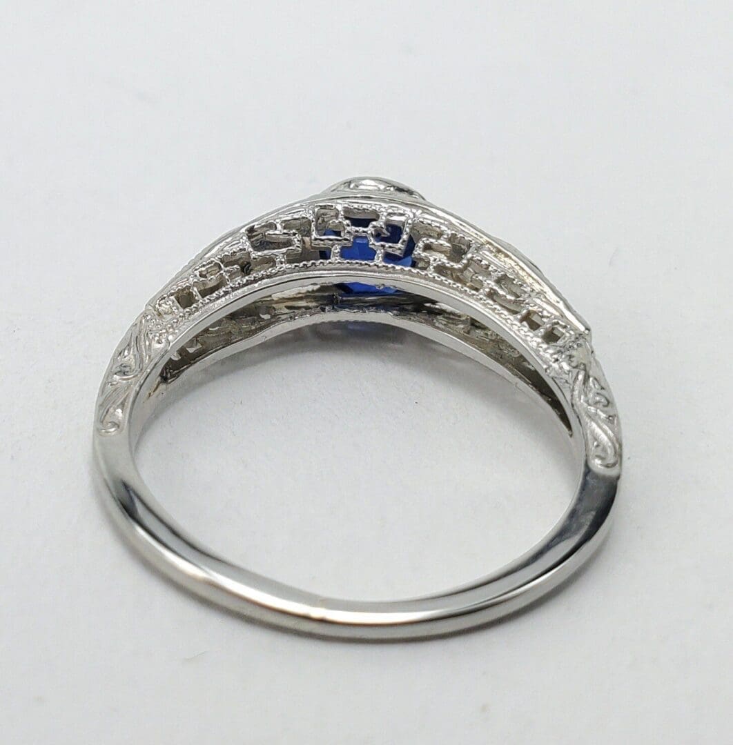 Ornate silver ring with intricate detailing.