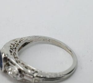 Silver ring with intricate design details.