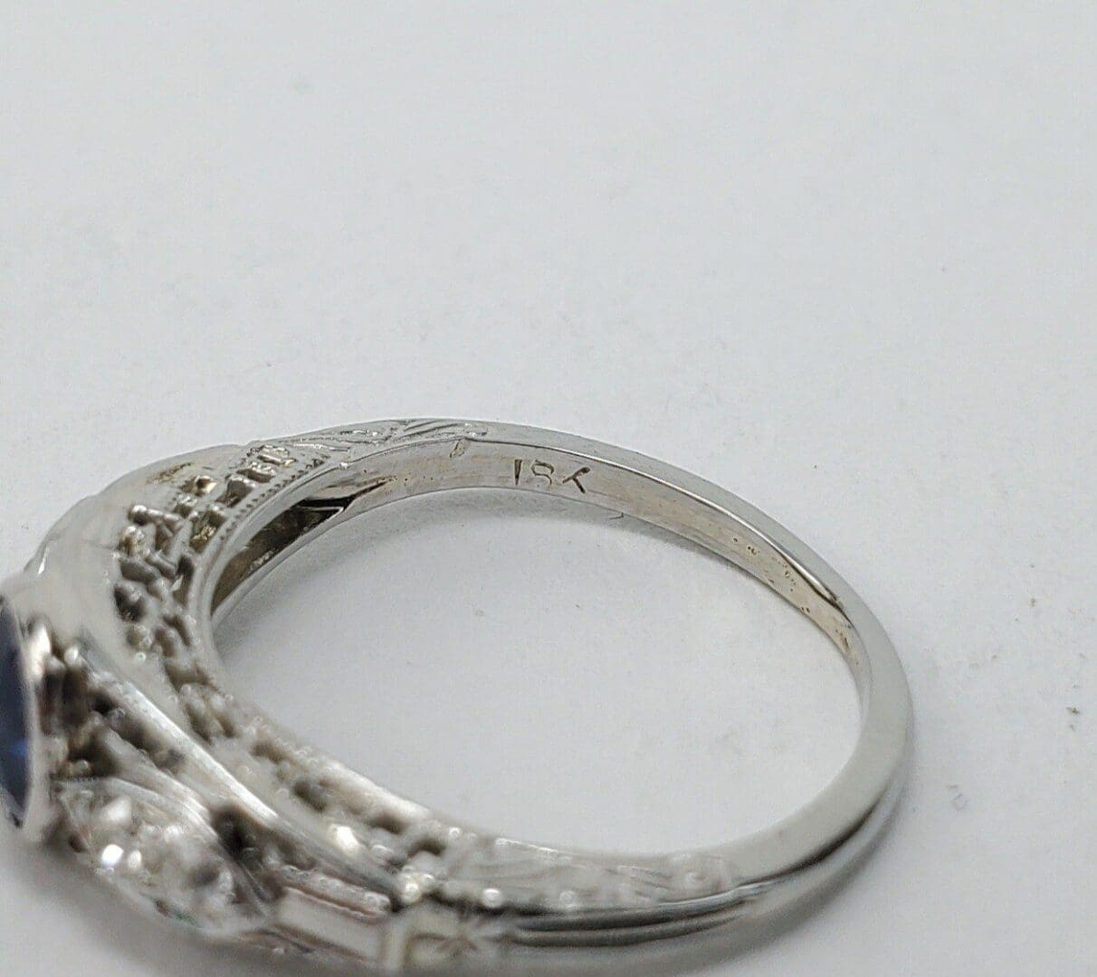 Silver ring with intricate design details.
