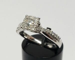 Diamond ring with square cluster setting.