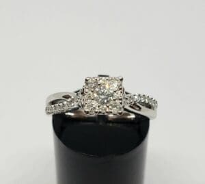 Diamond engagement ring with intricate band design.