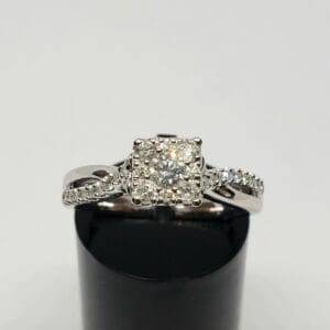 Diamond engagement ring with intricate band design.