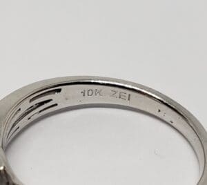 Engraved silver ring with "10K ZEI" marking.