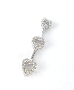 Three silver heart-shaped jewelry pieces connected.