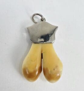Deer hoof pendant with silver top.