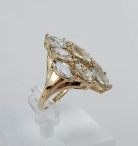 Gold ring with marquise-cut gemstones.