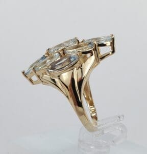 Gold ring with large clear gemstones.