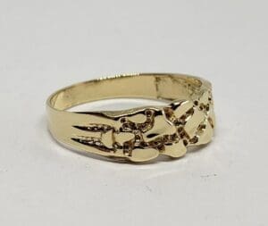 Gold ring with intricate interwoven design.