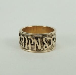 Gold ring with engraved Hebrew letters.